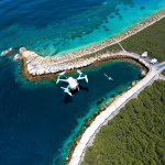 **Image Prompt for Remote Sensing Technology**: 
   "An aerial view of a coastal area showcasing the use of modern drones and remote sensing technology for data collection in marine engineering. Highlight the contrast between traditional methods and advanced technology, with drones capturing images over the ocean and underwater features being mapped."